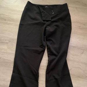 Black pants one button missing.